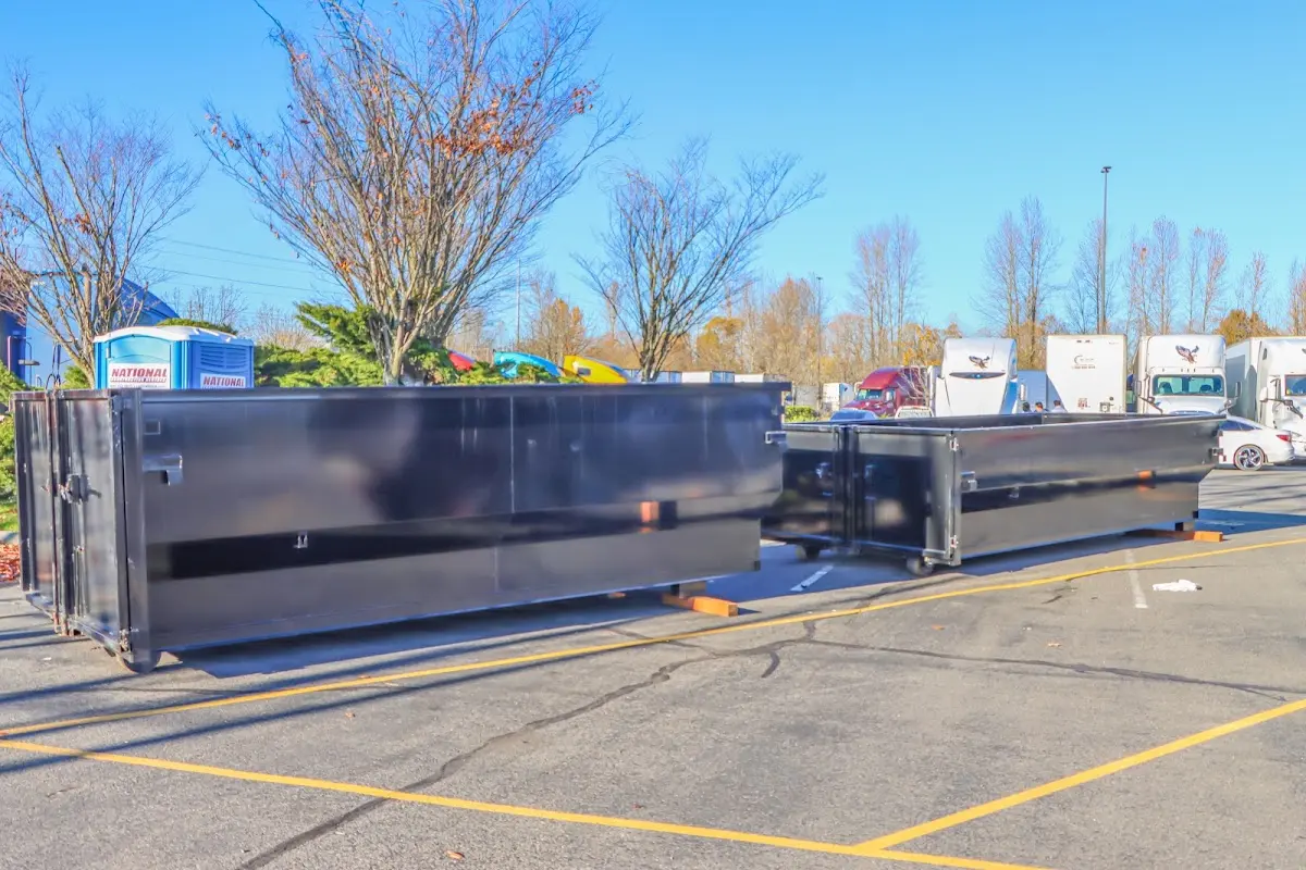 Professional dumpster rental service with roll-off container on residential driveway in Mineral Wells